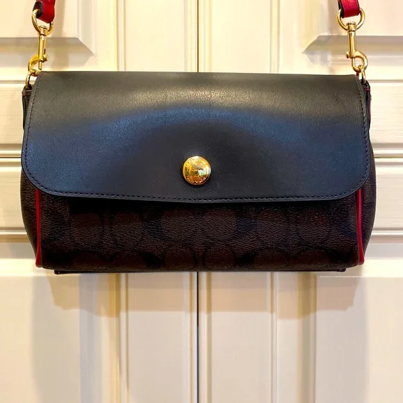 This is a like new coach cross body bag. - Picture 1 of 9